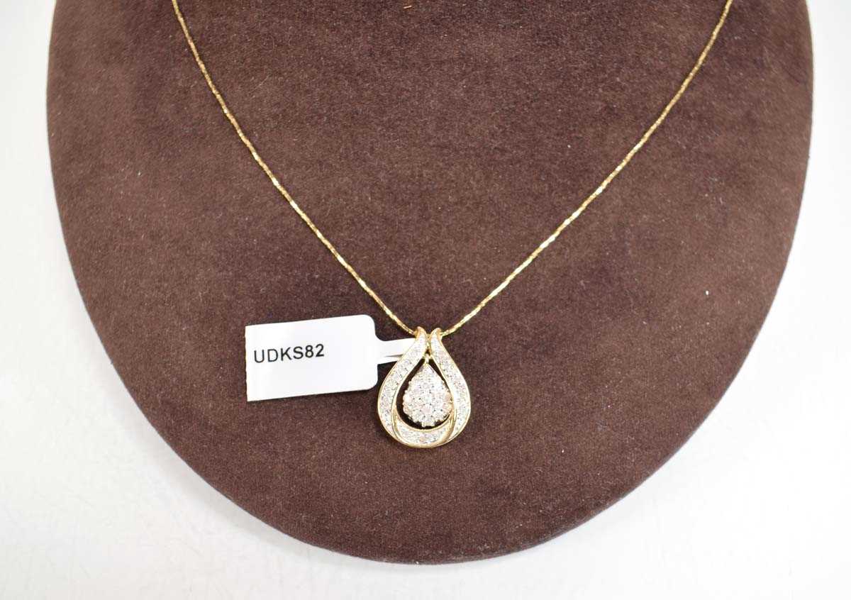 Lot 786 - A 9ct yellow gold pendant necklace set small...