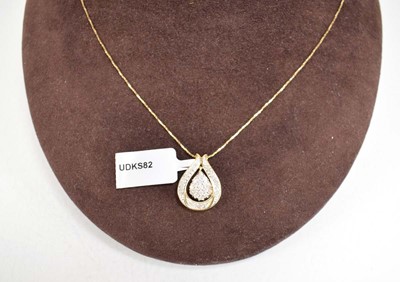 Lot 786 - A 9ct yellow gold pendant necklace set small...