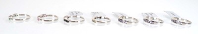 Lot 789 - Seven silver dress half eternity rings set...