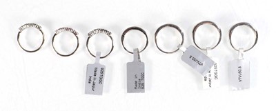 Lot 789 - Seven silver dress half eternity rings set...