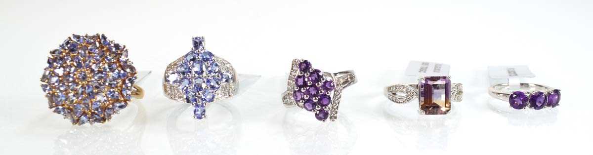 Lot 790 - Five silver dress rings set tanzanite coloured...