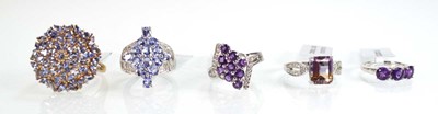 Lot 790 - Five silver dress rings set tanzanite coloured...