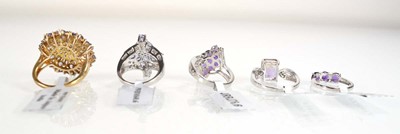 Lot 790 - Five silver dress rings set tanzanite coloured...