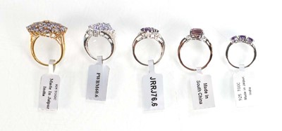 Lot 790 - Five silver dress rings set tanzanite coloured...
