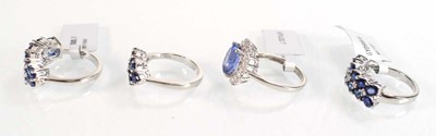 Lot 793 - Four silver dress rings set blue stones,...