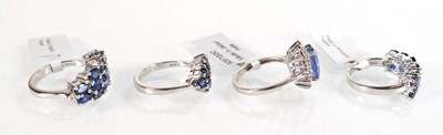 Lot 793 - Four silver dress rings set blue stones,...