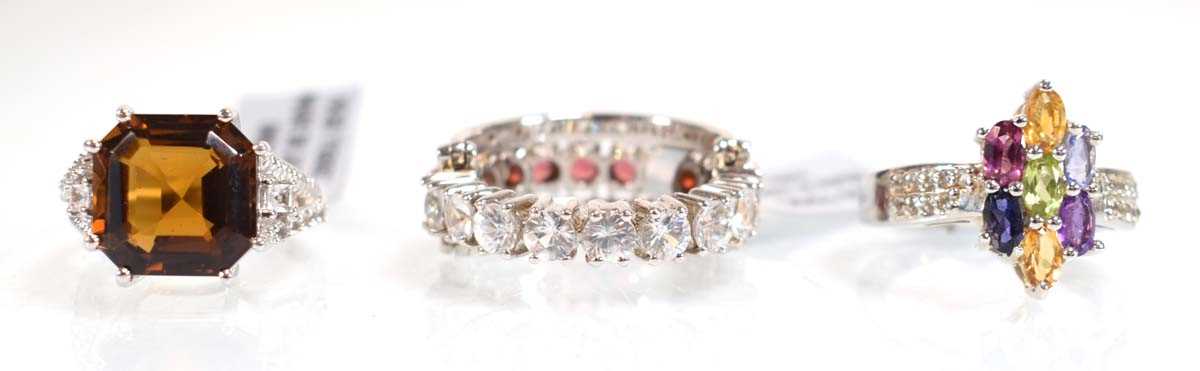 Lot 794 - Three silver dress rings set coloured stones,...