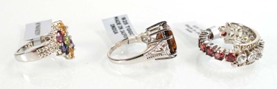 Lot 794 - Three silver dress rings set coloured stones,...