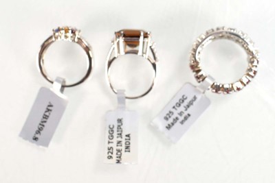Lot 794 - Three silver dress rings set coloured stones,...