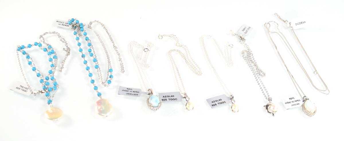 Lot 797 - Seven silver and metalware pendant necklaces...