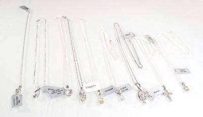 Lot 799 - Nine silver and metalware pendant necklaces...
