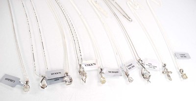 Lot 799 - Nine silver and metalware pendant necklaces...