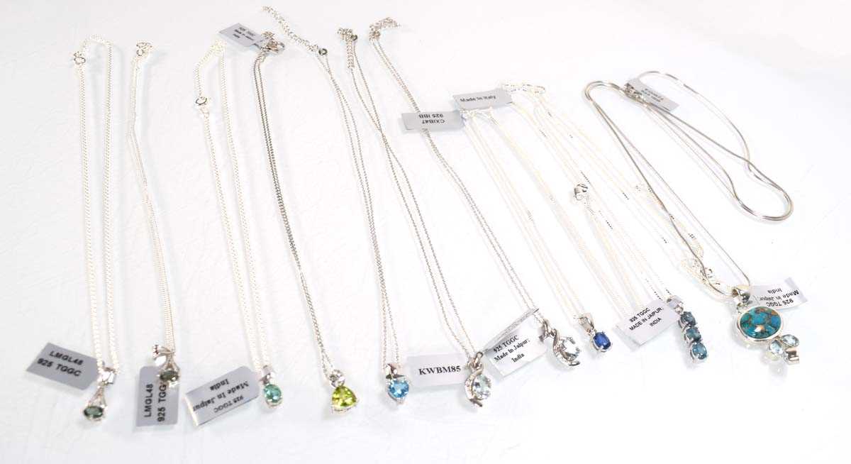 Lot 800 - Ten silver and metalware pendant necklaces set...