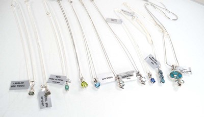 Lot 800 - Ten silver and metalware pendant necklaces set...