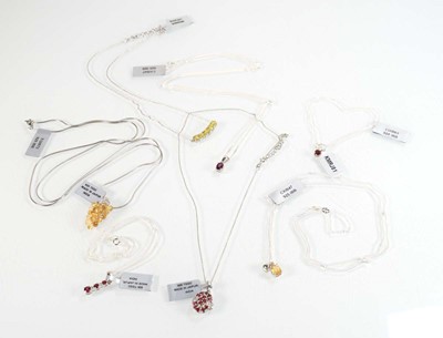 Lot 801 - Seven silver and metalware pendant necklaces...