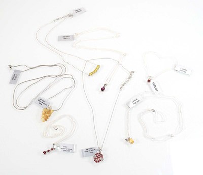 Lot 801 - Seven silver and metalware pendant necklaces...