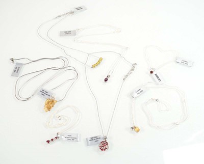 Lot 801 - Seven silver and metalware pendant necklaces...