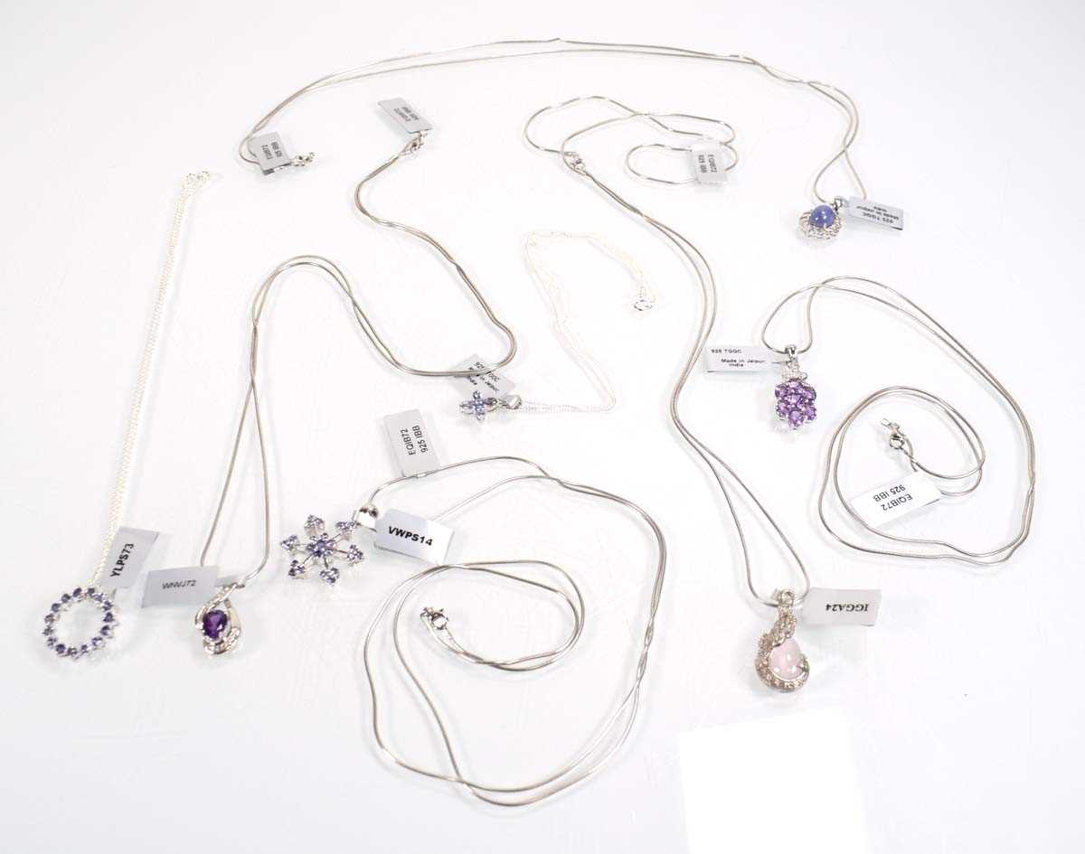 Lot 803 - Seven silver and metalware pendant necklaces...