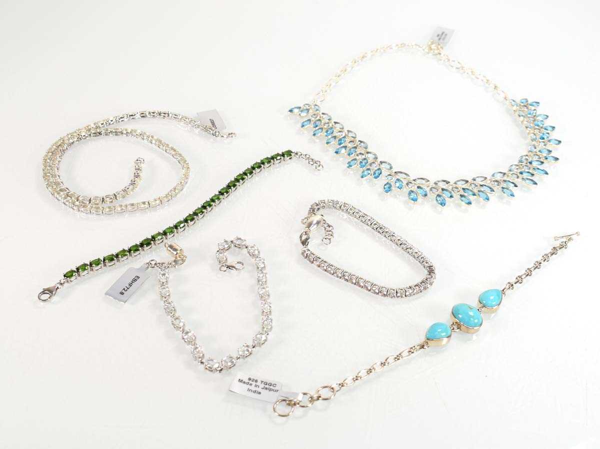 Lot 805 - Four silver and metalware bracelets including...