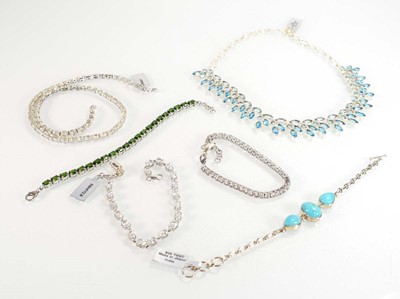 Lot 805 - Four silver and metalware bracelets including...