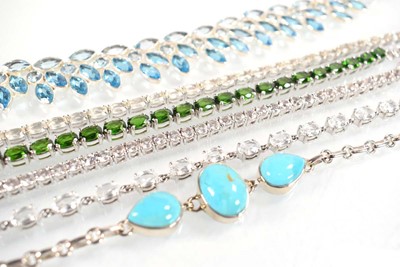 Lot 805 - Four silver and metalware bracelets including...