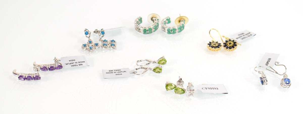 Lot 811 - Seven pairs of silver ear pendants and studs,...