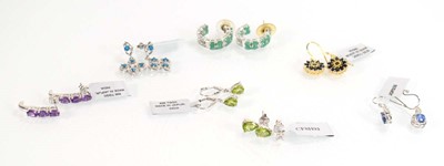 Lot 811 - Seven pairs of silver ear pendants and studs,...
