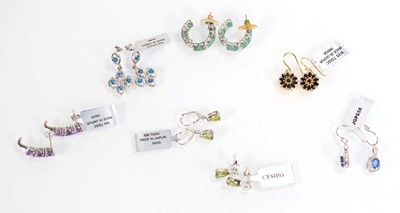 Lot 811 - Seven pairs of silver ear pendants and studs,...