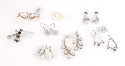 Lot 812 - Eight pairs of silver ear pendants and studs,...