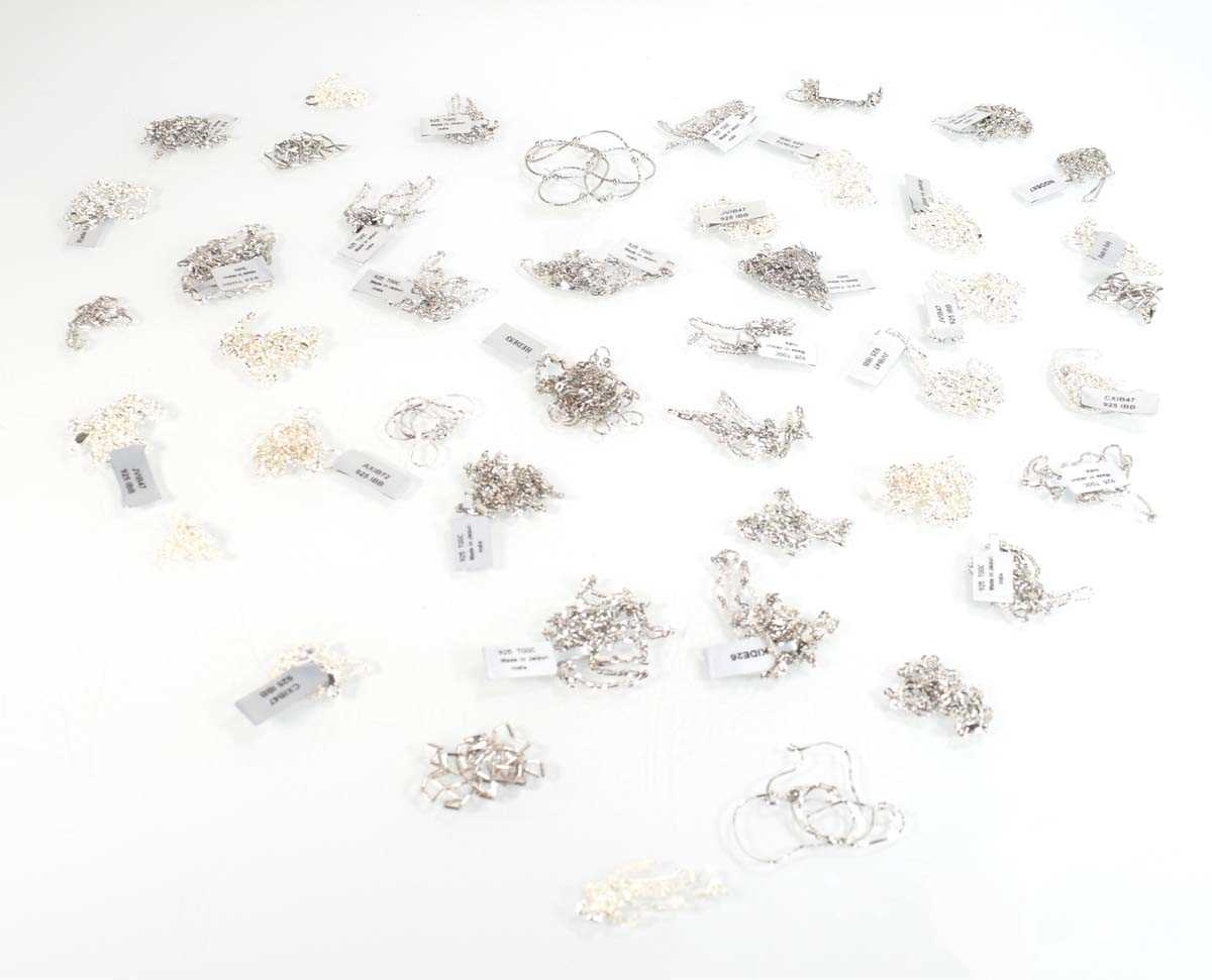 Lot 814 - Forty-four silver necklaces, various links and...