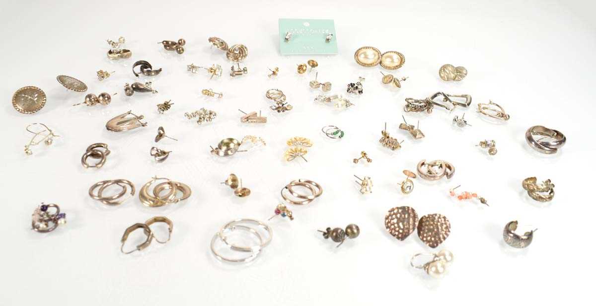 Lot 826 - A collection of silver and metalware ear studs...