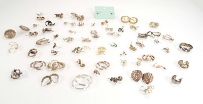 Lot 826 - A collection of silver and metalware ear studs...