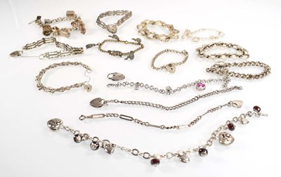 Lot 829 - Fourteen silver and metalware charm and...