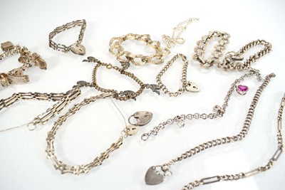 Lot 829 - Fourteen silver and metalware charm and...