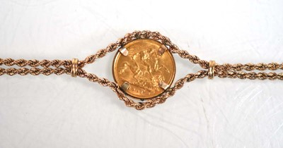 Lot 978 - A 9ct yellow gold ropetwist bracelet set an...