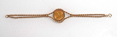Lot 978 - A 9ct yellow gold ropetwist bracelet set an...