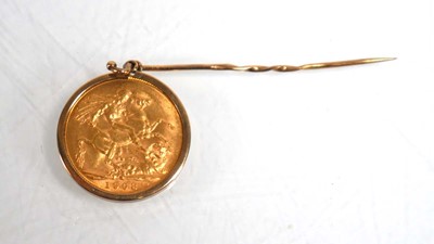 Lot 979 - A 9ct yellow gold stick pin set an Edwardian...