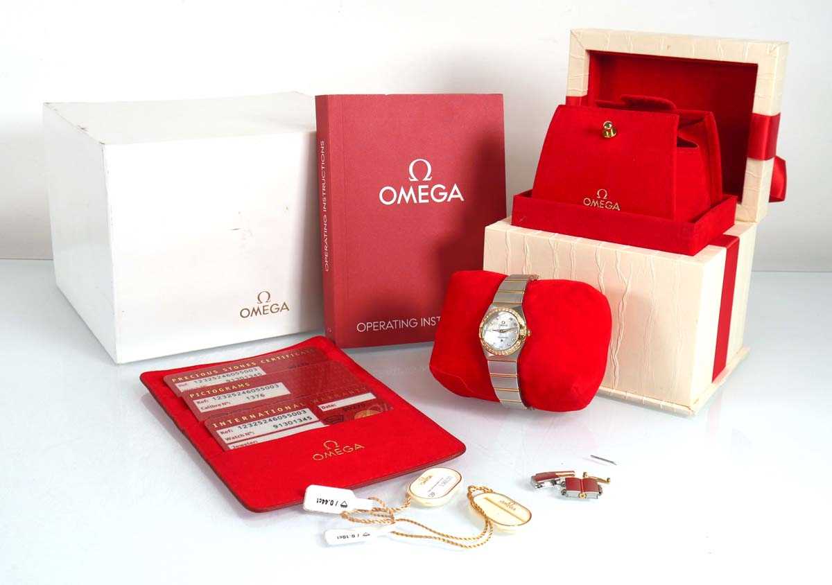 Lot 900 - A ladies stainless steel and gold plated...