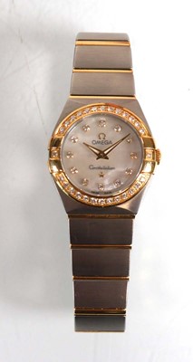 Lot 900 - A ladies stainless steel and gold plated...
