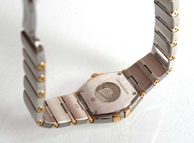 Lot 900 - A ladies stainless steel and gold plated...