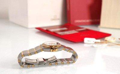 Lot 900 - A ladies stainless steel and gold plated...