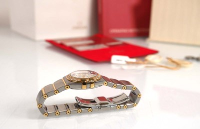 Lot 900 - A ladies stainless steel and gold plated...