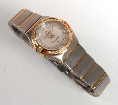 Lot 900 - A ladies stainless steel and gold plated...