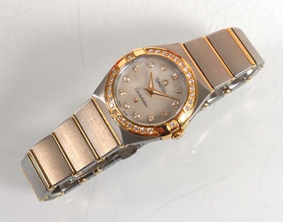 Lot 900 - A ladies stainless steel and gold plated...