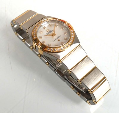 Lot 900 - A ladies stainless steel and gold plated...