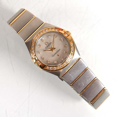 Lot 900 - A ladies stainless steel and gold plated...