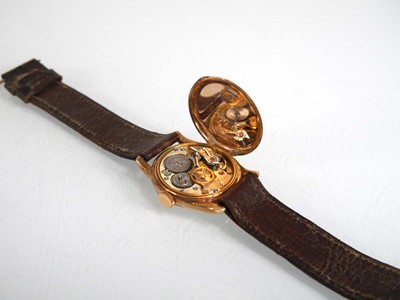 Lot 903 - A ladies 9ct yellow gold wristwatch by Rolex,...