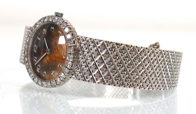 Lot 910 - A ladies 18ct white gold cocktail wristwatch...