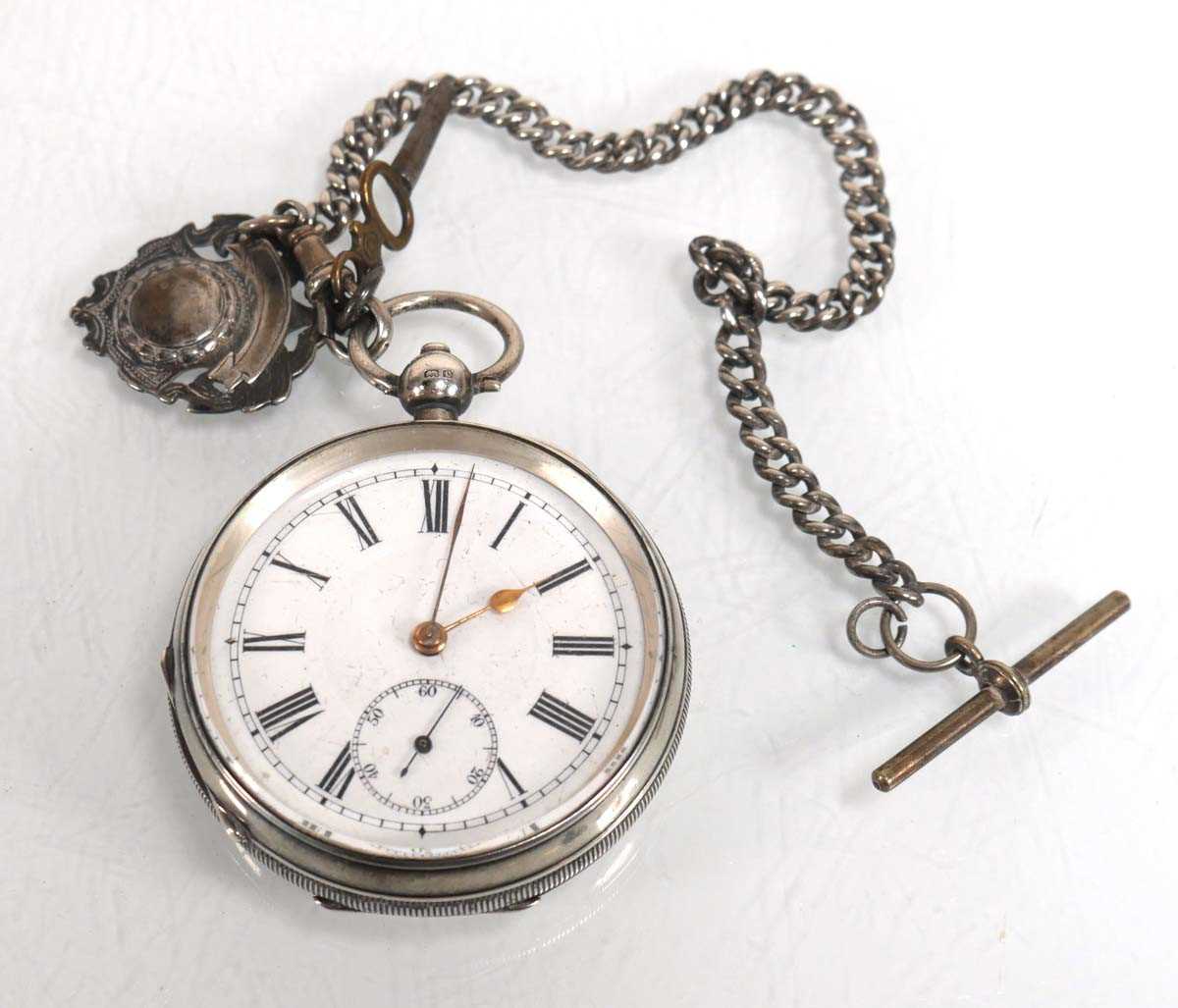Lot 933 - A silver open face pocket watch, the white...