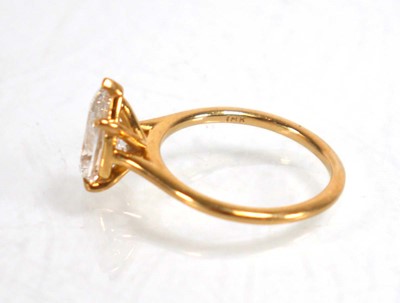 Lot 831 - An 18ct yellow gold ring set pear shaped lab...